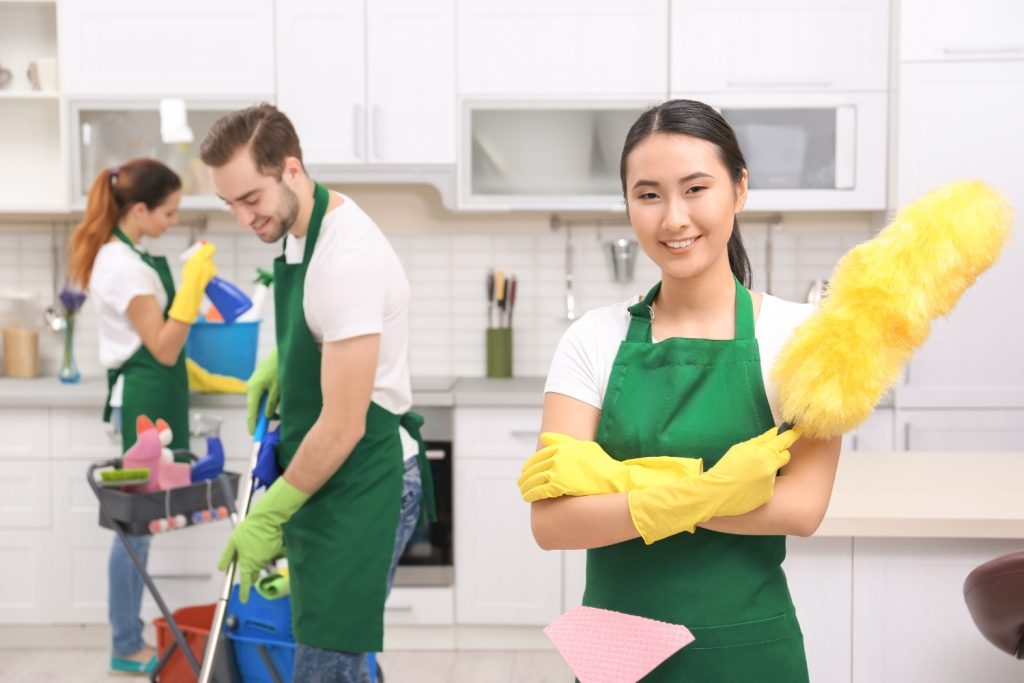 Friendly professional cleaning team performing residential kitchen cleaning services in Delaware County