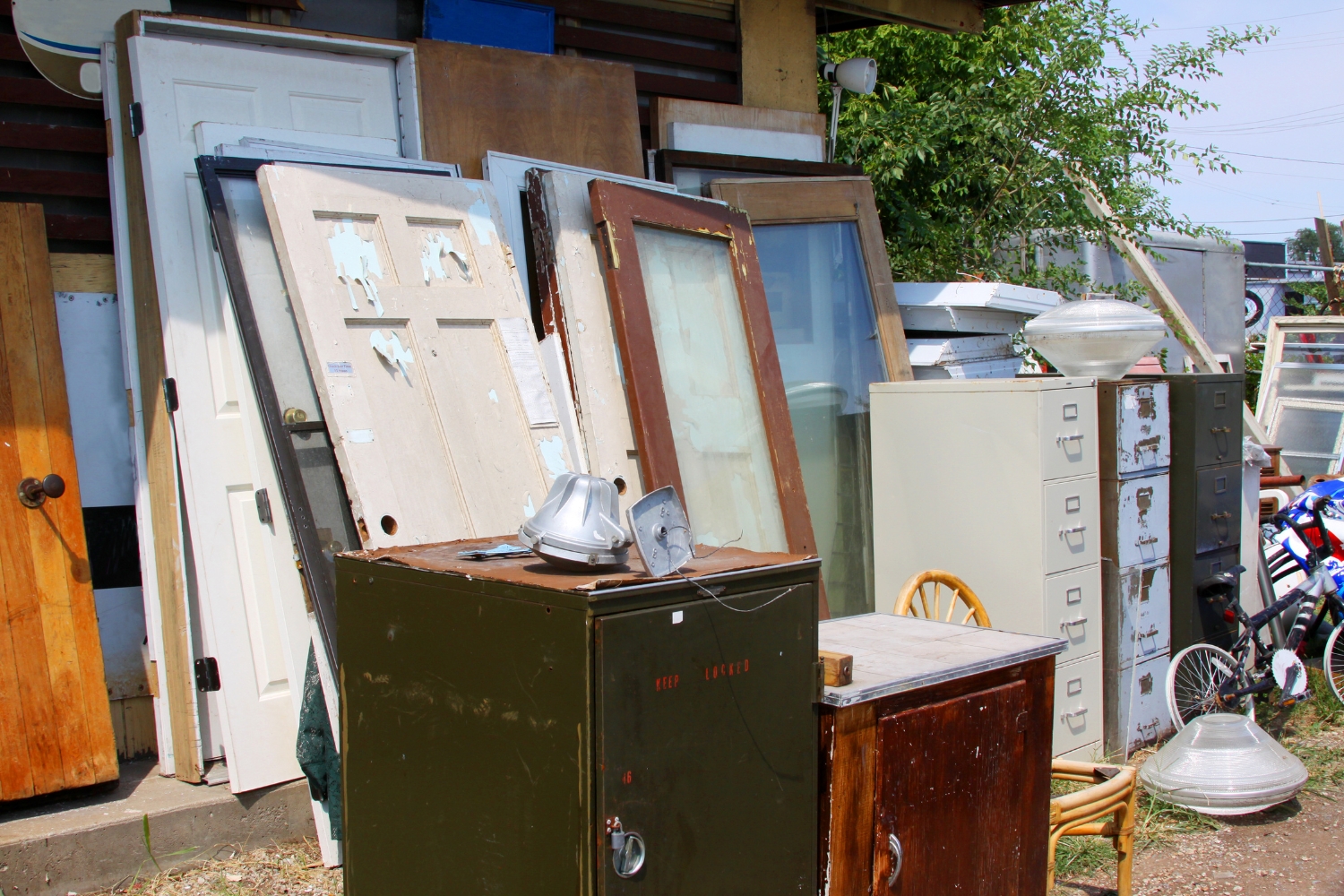 Furniture, doors and office cabinets prepared for professional junk removal