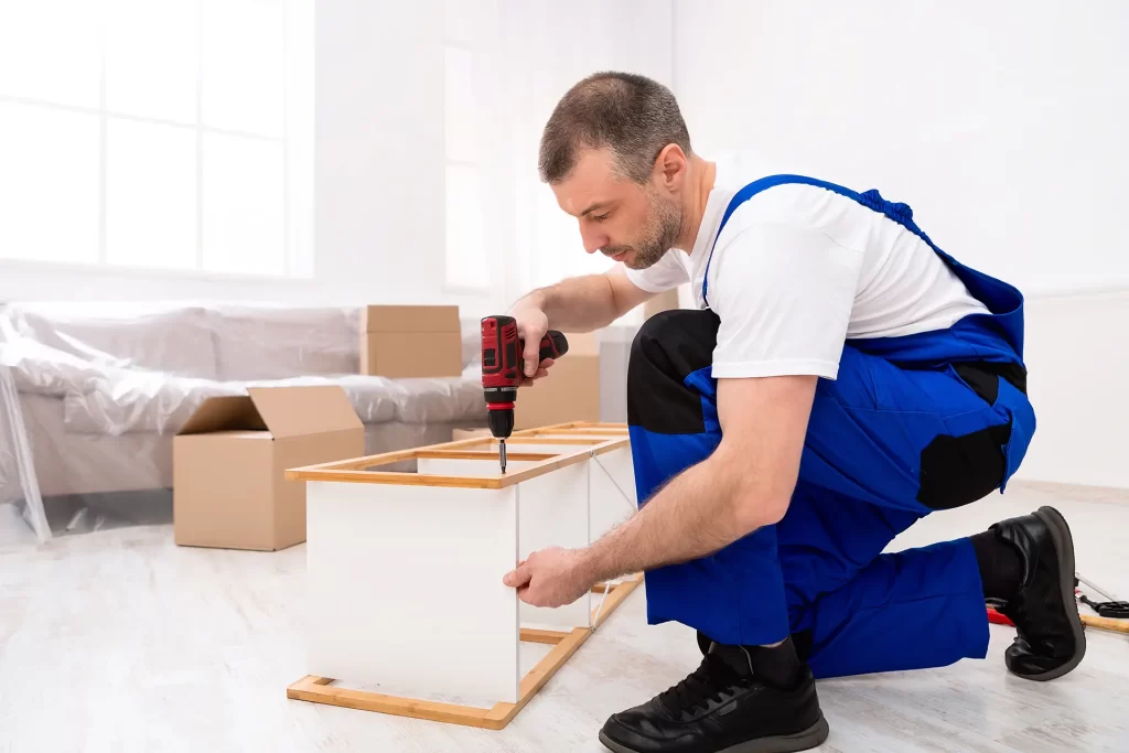 Delaware County movers assembling furniture during a residential move