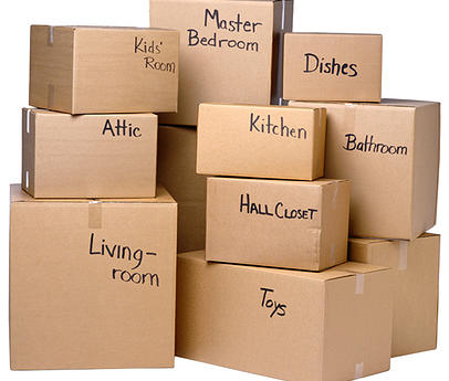 Labeled moving boxes organized by room for a residential move in Delaware County