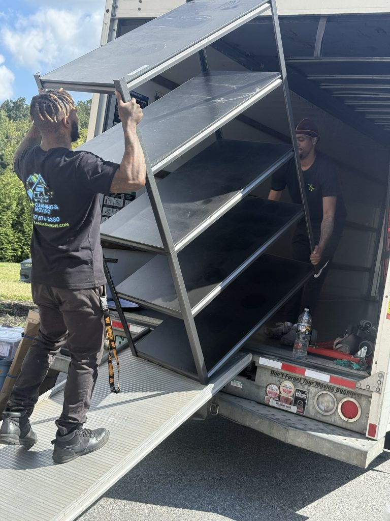 Movers loading furniture into a moving truck in Delaware County PA — A+ Cleaning & Moving short-distance movers