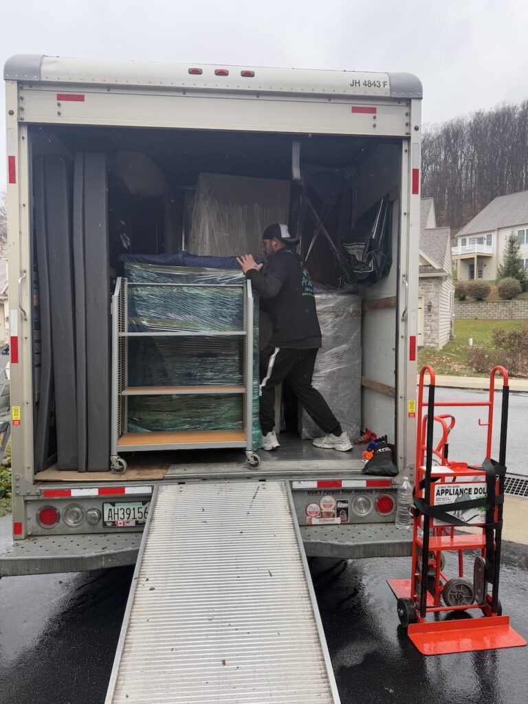 Professional movers carrying furniture during a residential move in Philadelphia