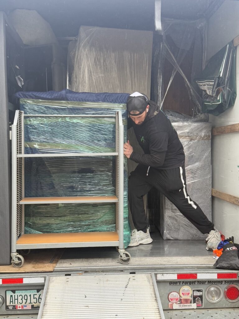 Professional movers loading a moving truck during a residential move in Fishtown Philadelphia