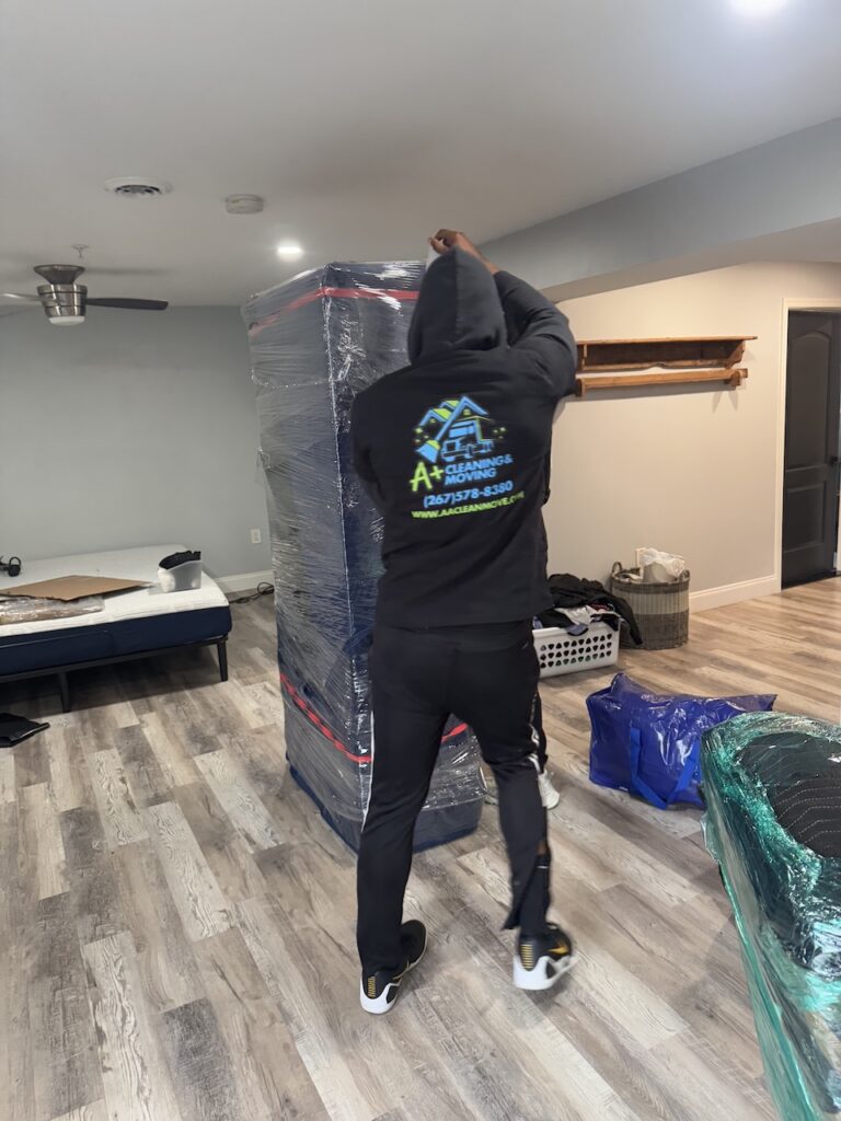 Center City Philadelphia movers loading furniture into a truck near high-rise apartments