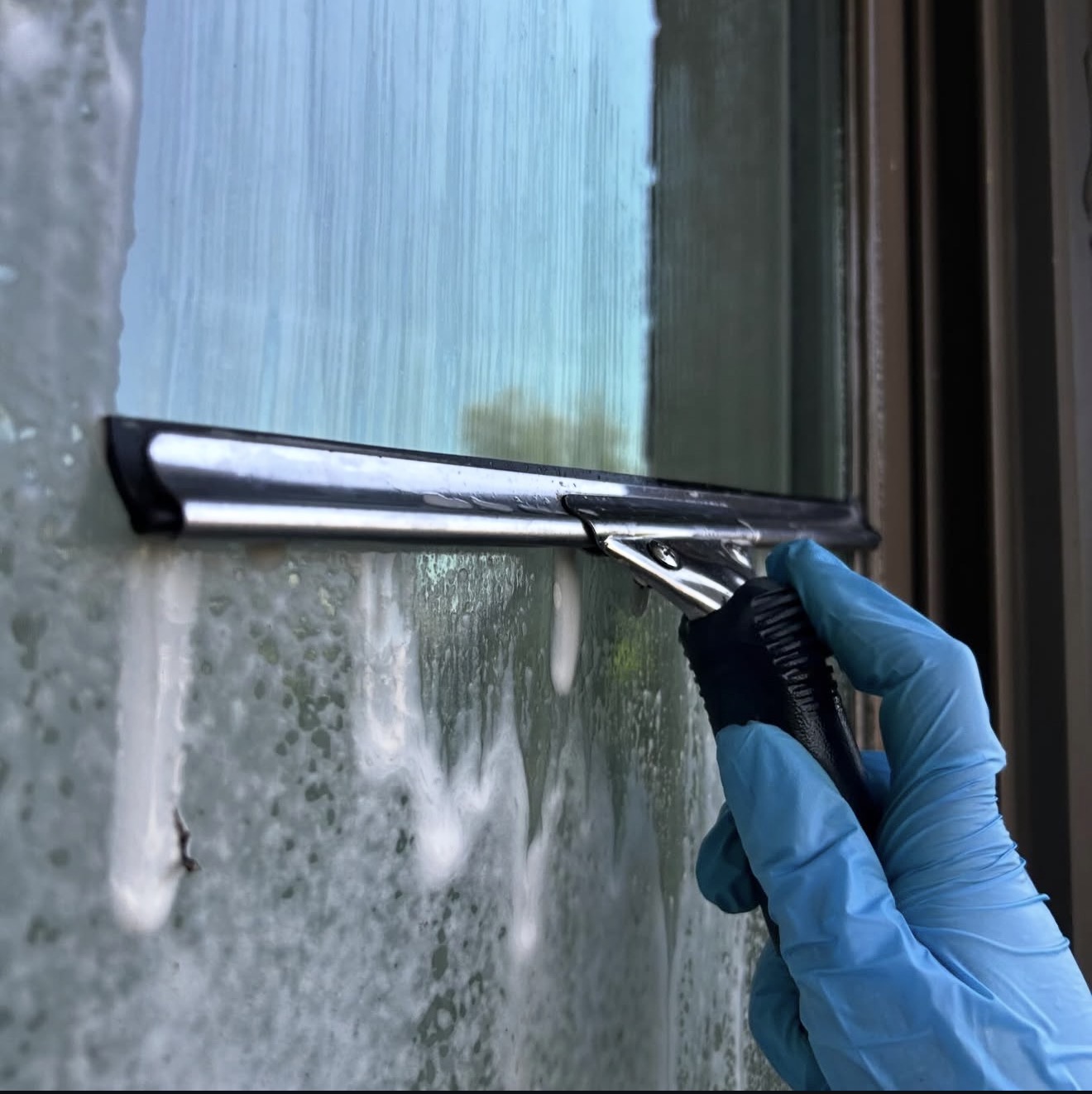 Professional commercial cleaning service disinfecting bathroom fixtures for office and business properties