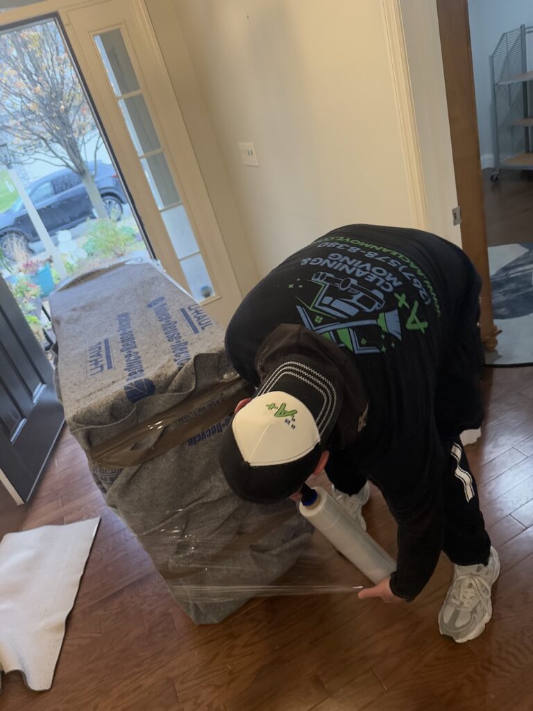 Professional Chester County mover protecting floors and preparing a home for moving day