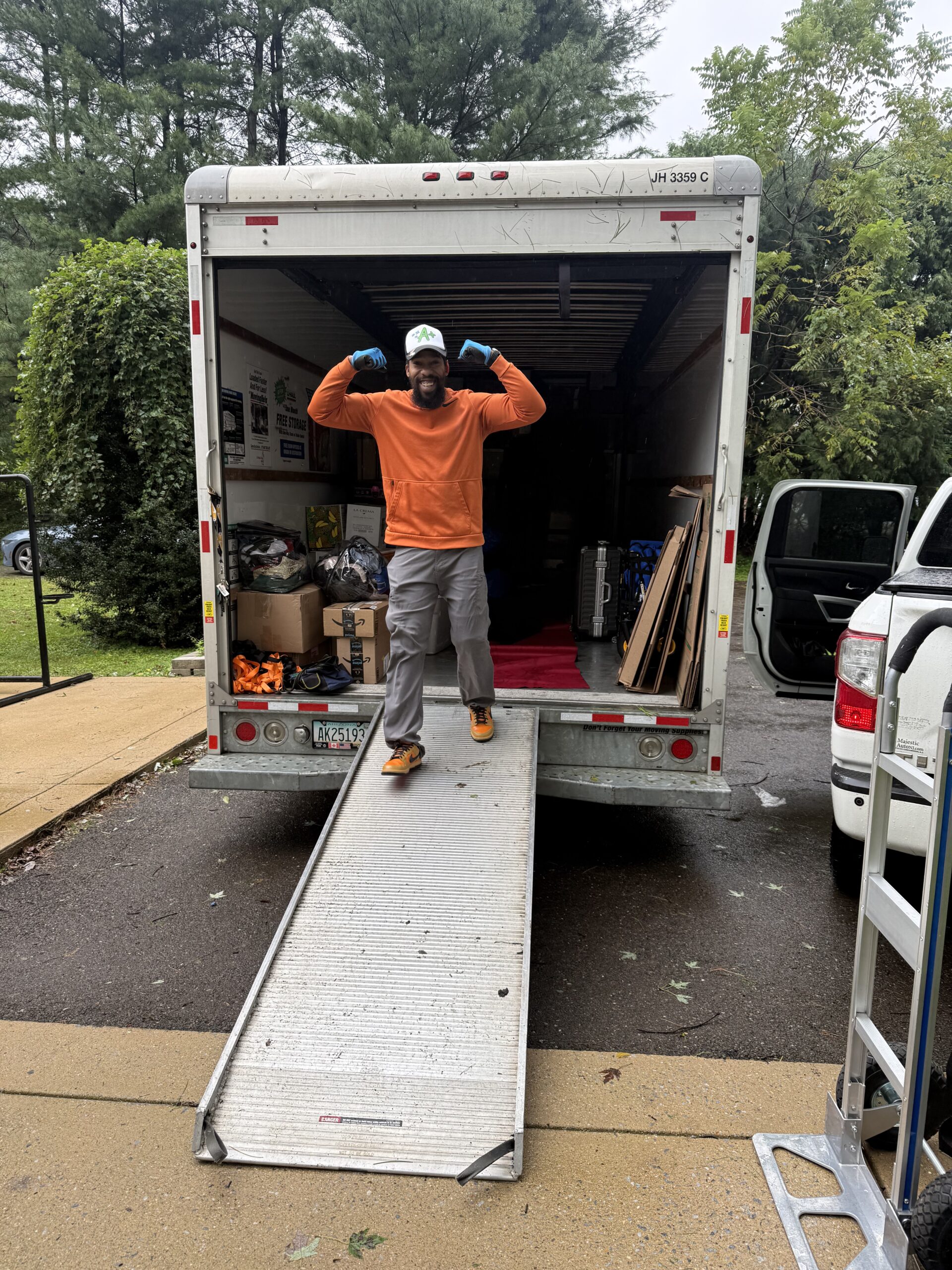 A Plus mover loading household belongings into a moving truck