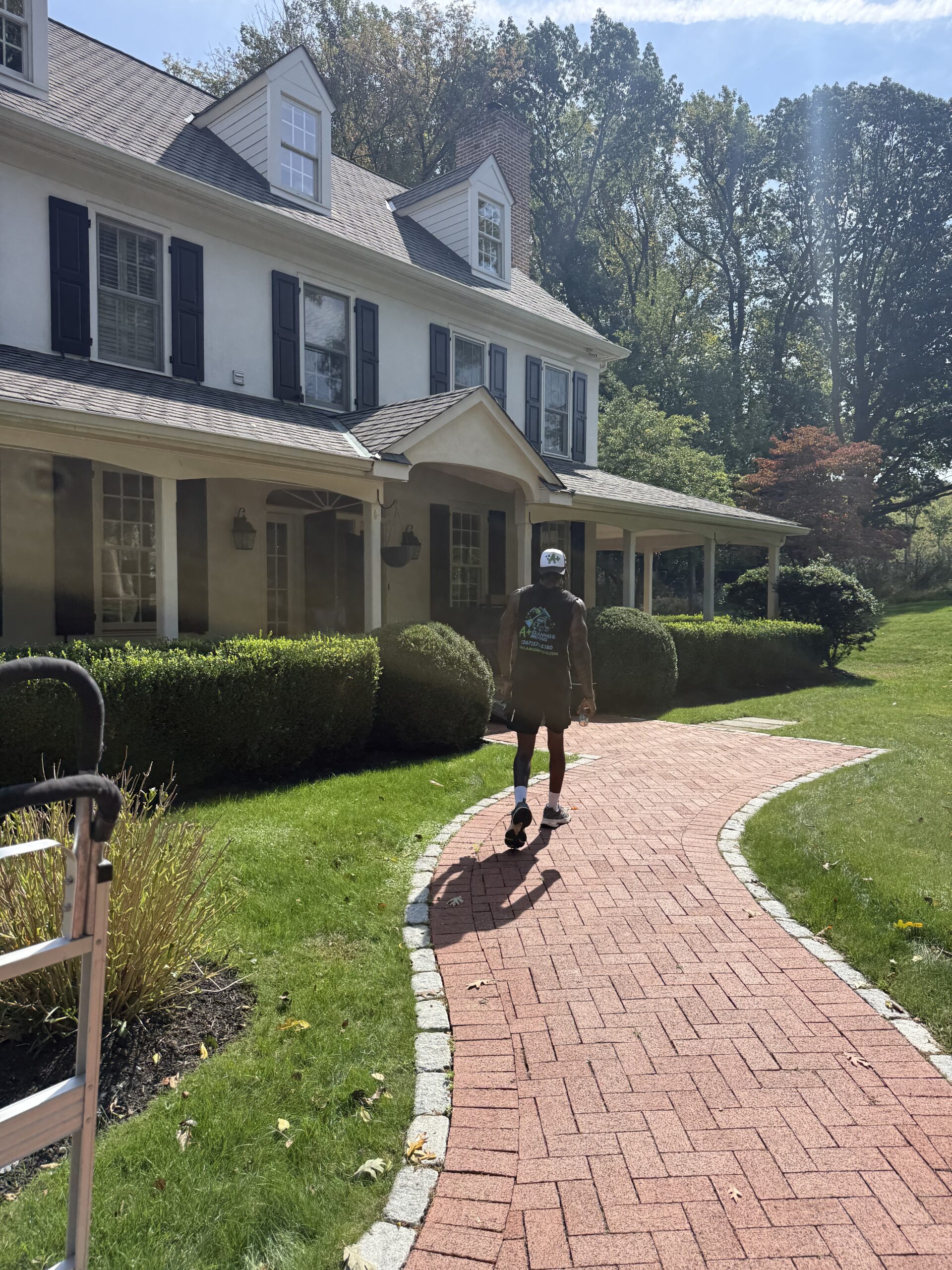 Landscaped walkway leading to a residential home before a move